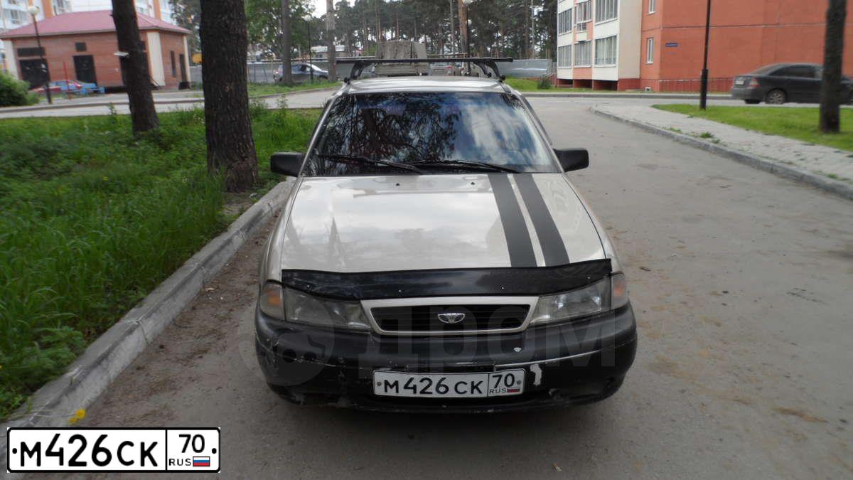 Фото автомобиля DAEWOO NEXIA, 1998 — госномер М426СК70. Цвет: КОРИЧНЕВЫЙ