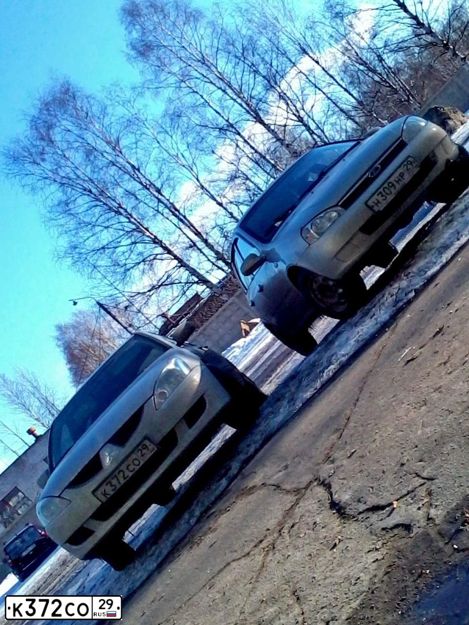 Фото автомобиля MITSUBISHI LANCER, 2004 — госномер К372СО29. Цвет: СЕРЕБРИСТЫЙ