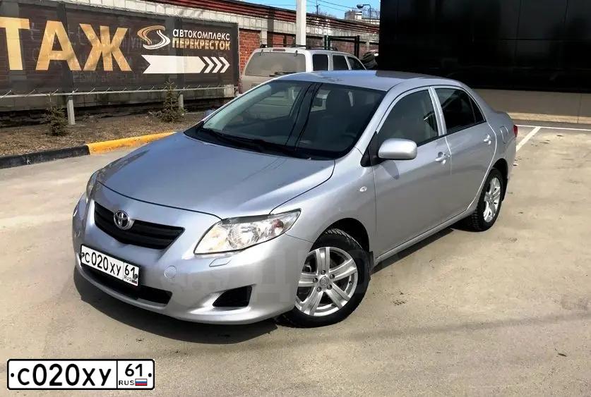 Фото автомобиля TOYOTA COROLLA, 2007 — госномер Н735ВР70. Цвет: Серебристый