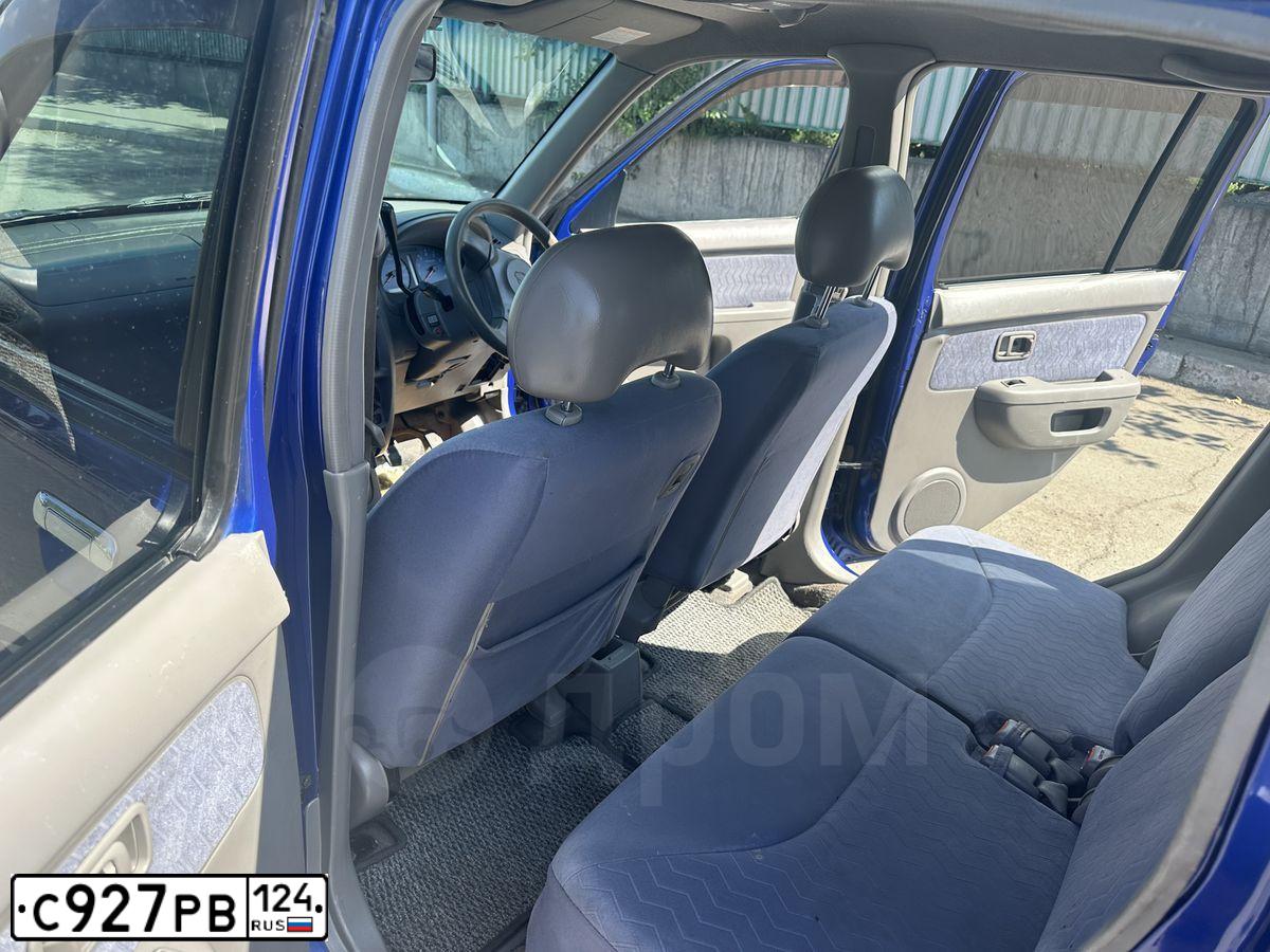 Фото автомобиля NISSAN CUBE, 2000 — госномер С927РВ124