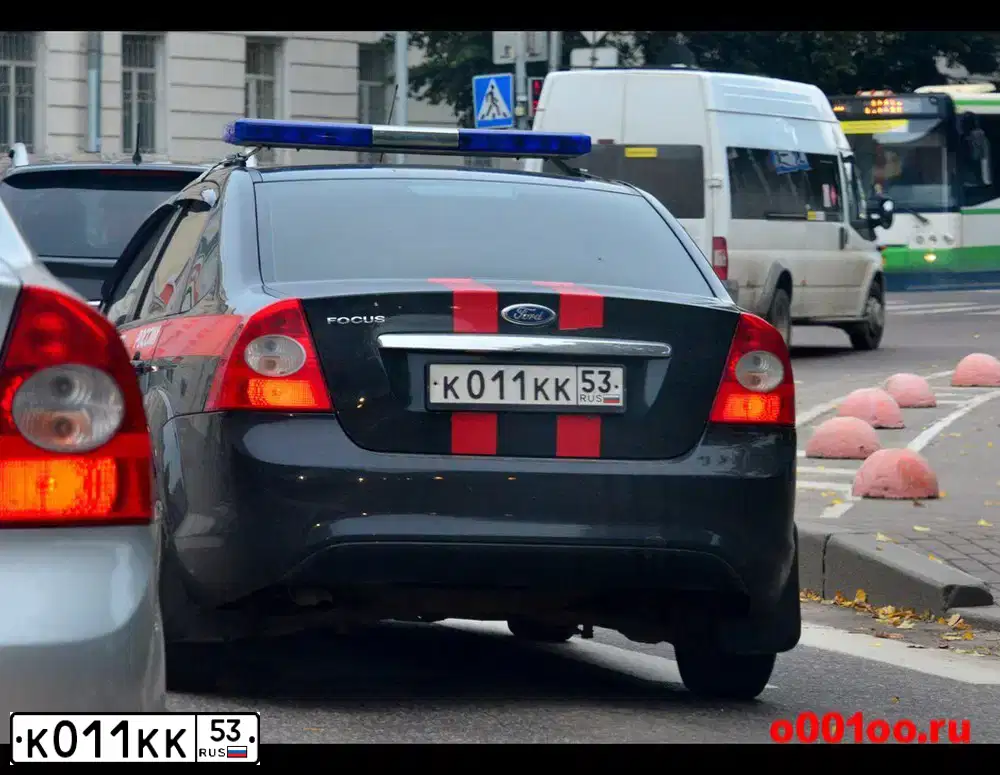 Фото автомобиля FORD FOCUS, 2009 — госномер К011КК53. Цвет: ГОСТ Р 50574