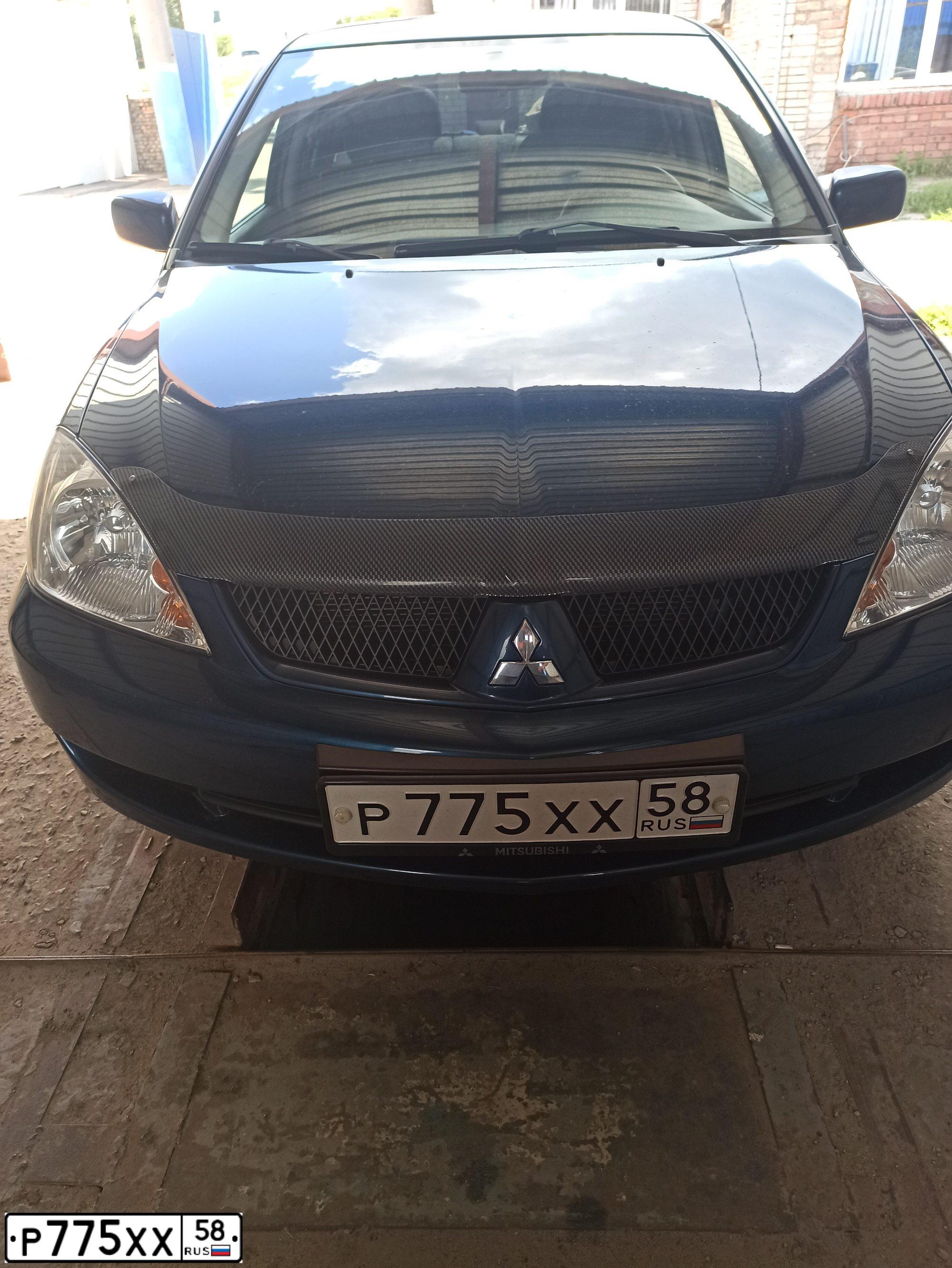 Фото автомобиля MITSUBISHI LANCER, 2006 — госномер В302МН177. Цвет: СИНИЙ