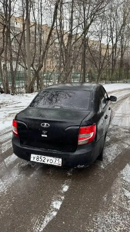 Фото автомобиля LADA 2190 GRANTA, 2012 — госномер У852УО71. Цвет: серебристо-коричневый