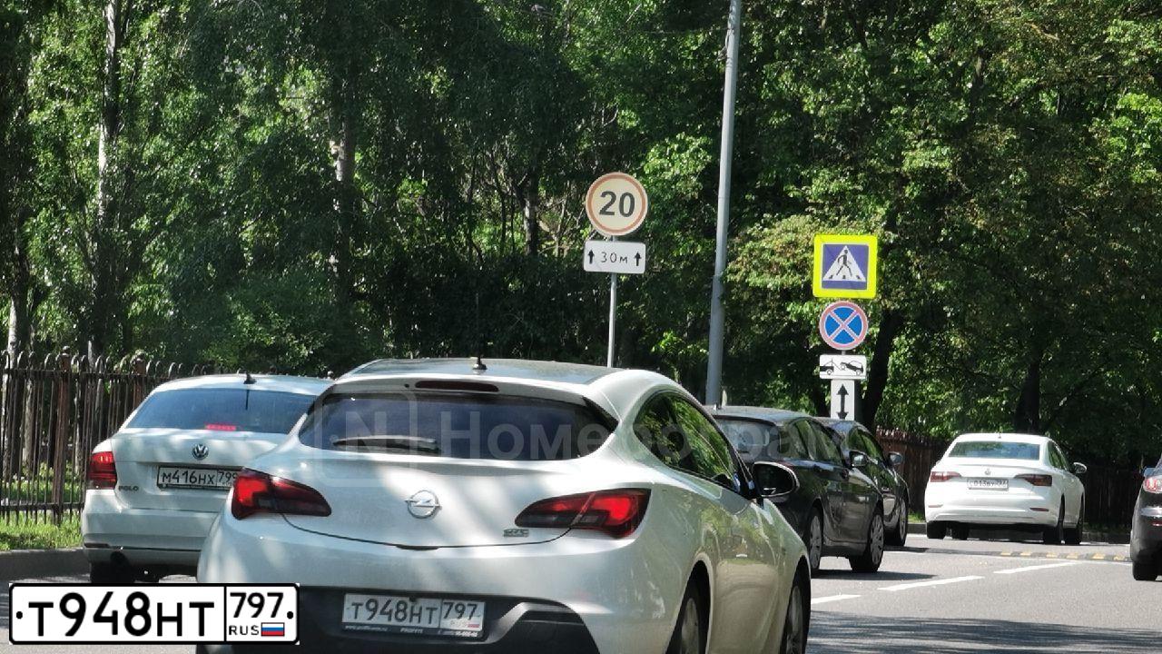 Фото автомобиля OPEL ASTRA, 2012 — госномер Т948НТ797. Цвет: Белый