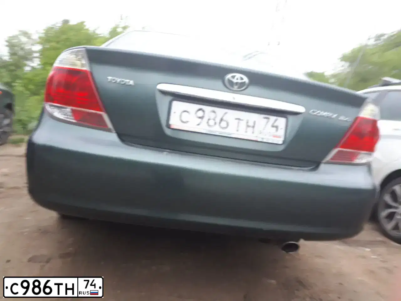 Фото автомобиля TOYOTA CAMRY, 2004 — госномер С986ТН174. Цвет: Темно-зеленый