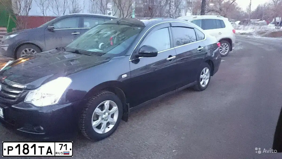 Фото автомобиля NISSAN ALMERA /AVTOVAZ/, 2014 — госномер Т112ОТ71. Цвет: ЧЕРНЫЙ