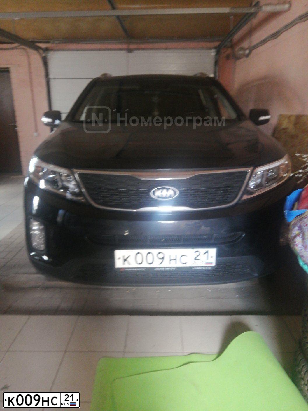 Фото автомобиля KIA SORENTO, 2019 — госномер К009НС21. Цвет: ЧЕРНЫЙ