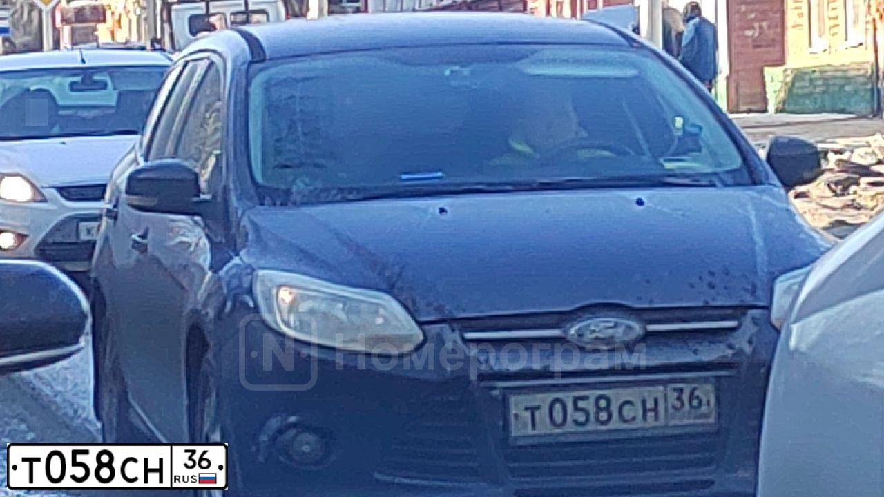 Фото автомобиля FORD D FOCUS, 2012 — госномер Т058СН36. Цвет: ТЕМНО-СИНИЙ