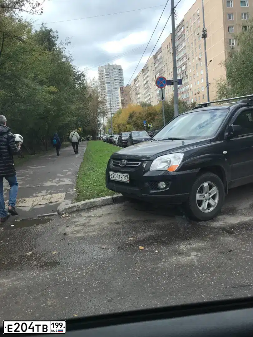 Фото автомобиля KIA SPORTAGE, 2009 — госномер Е204ТВ199. Цвет: ЧЕРНЫЙ МЕТАЛЛИК