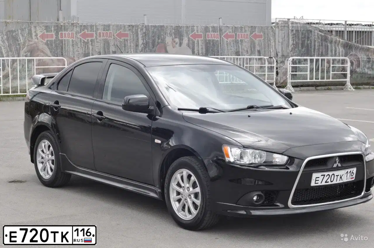 Фото автомобиля MITSUBISHI LANCER, 2011 — госномер Е720ТК116. Цвет: ЧЕРНЫЙ