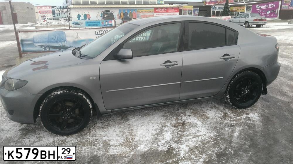 Фото автомобиля MAZDA 3, 2005 — госномер К579ВН29. Цвет: Серый