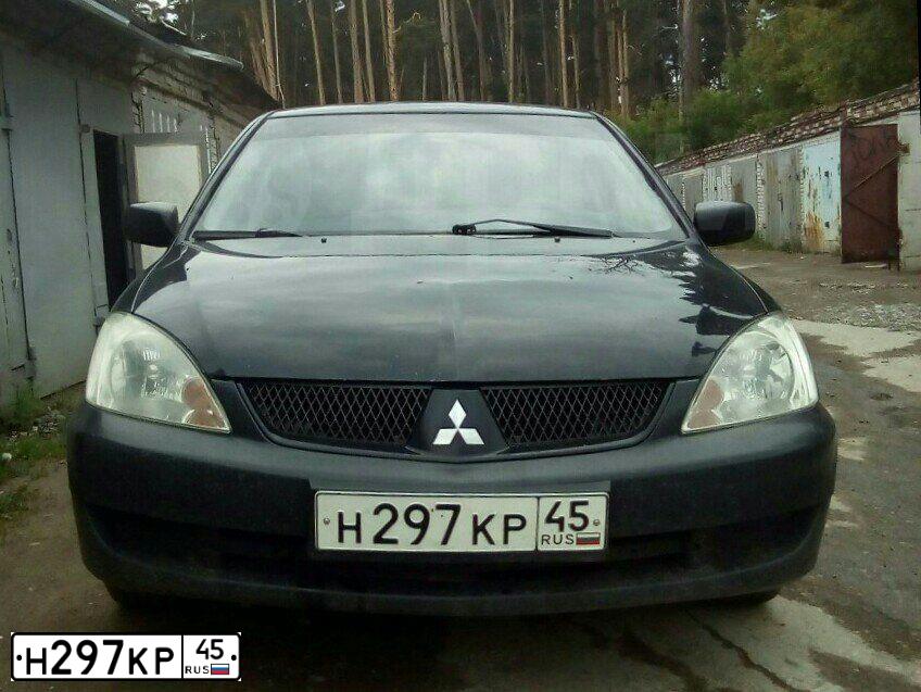 Фото автомобиля MITSUBISHI LANCER, 2006 — госномер Р775ХС72. Цвет: ЧЕРНЫЙ