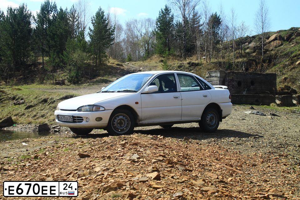 Фото автомобиля MITSUBISHI MIRAGE, 1992 — госномер Е670ЕЕ124