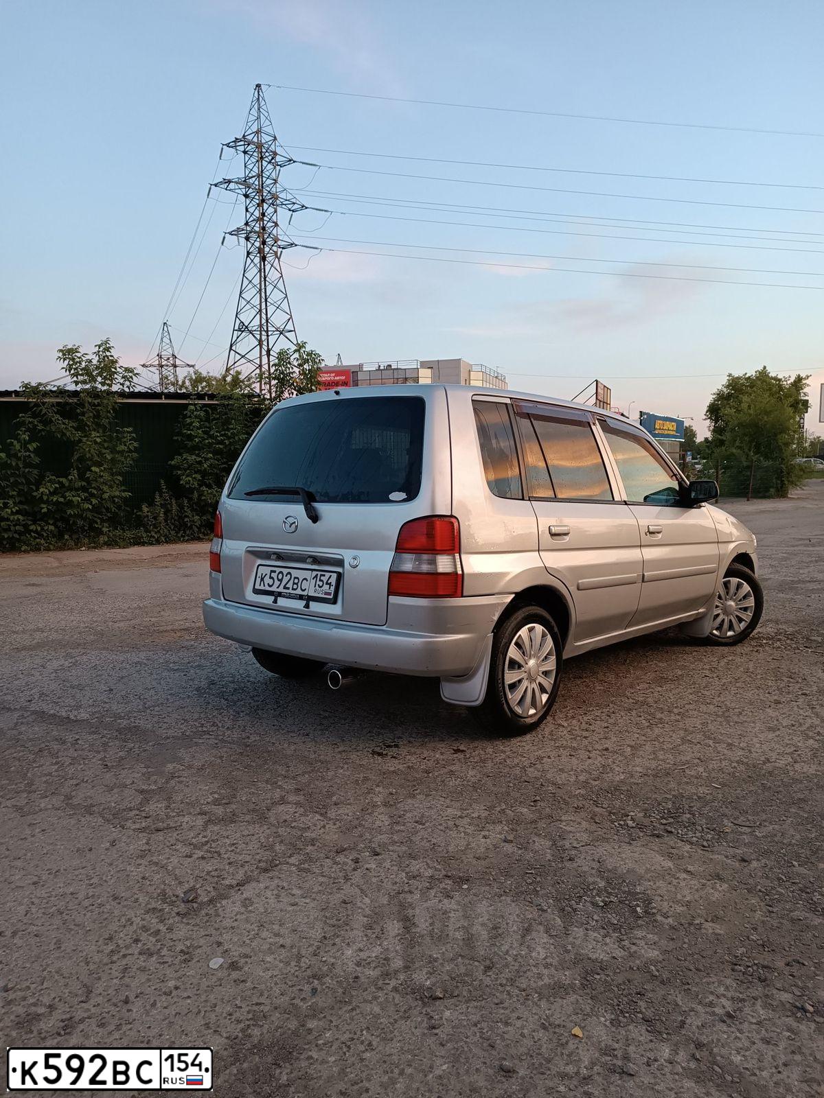 Фото автомобиля KIA RIO, 2012 — госномер Р553ЕК154. Цвет: синий