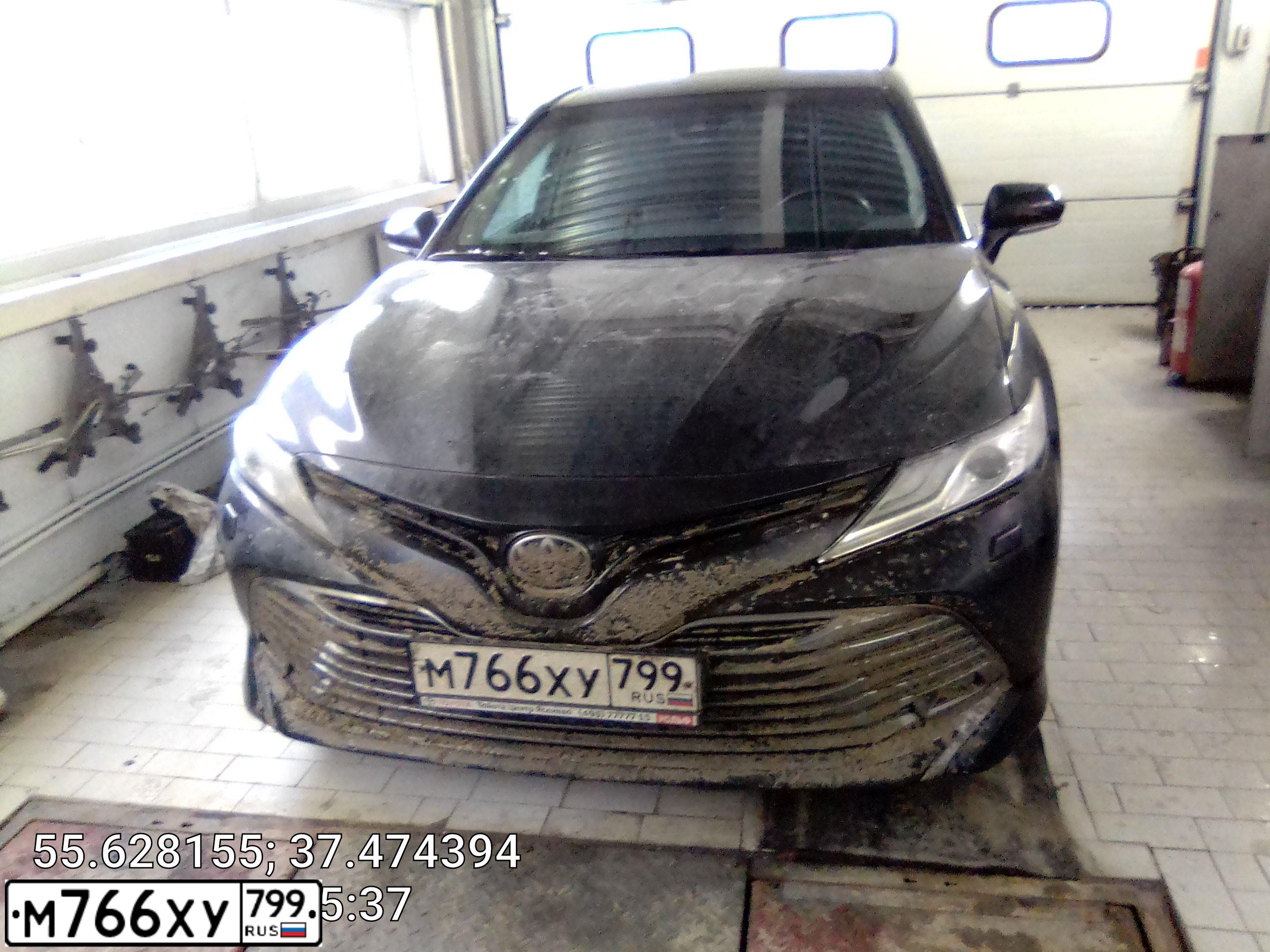 Фото автомобиля TOYOTA CAMRY, 2018 — госномер Е591МН799. Цвет: ЧЕРНЫЙ МЕТАЛЛИК