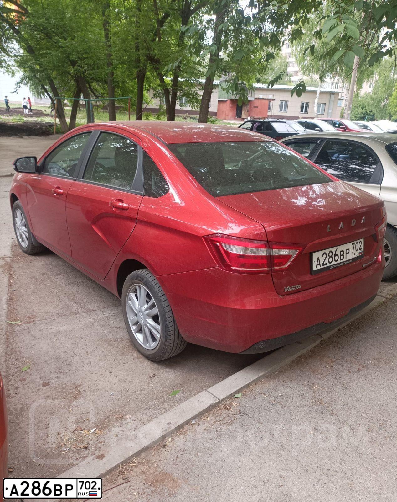 Фото автомобиля LADA VESTA, 2019 — госномер А286ВР702. Цвет: КРАСНЫЙ