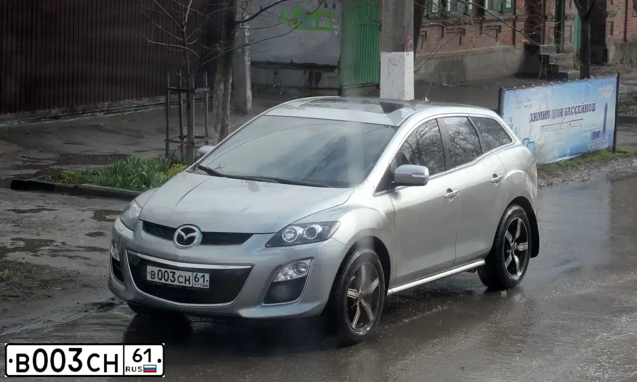 Фото автомобиля MAZDA CX-7, 2011 — госномер В003СН61. Цвет: СЕРЕБРИСТЫЙ