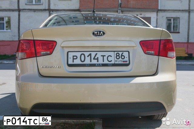 Фото автомобиля KIA CERATO, 2009 — госномер Р014ТС86. Цвет: ЗОЛОТИСТЫЙ