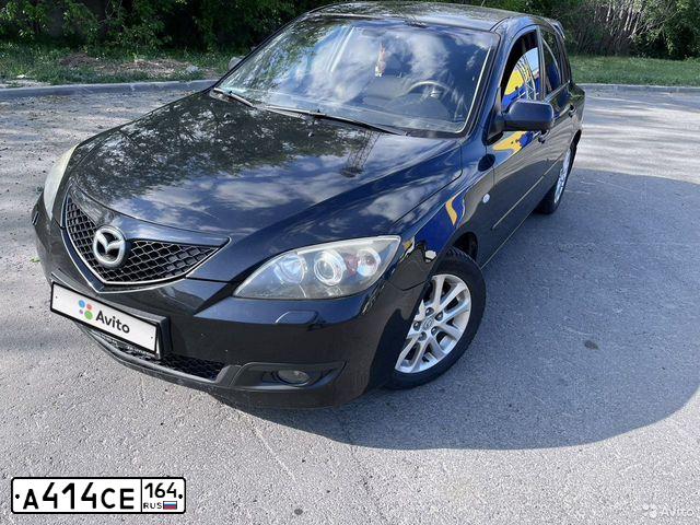 Фото автомобиля MAZDA 3, 2008 — госномер К001АР64. Цвет: ЧЕРНЫЙ
