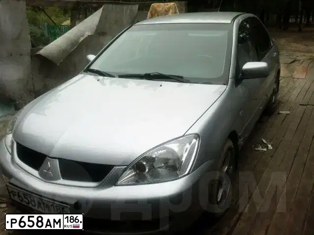 Фото автомобиля MITSUBISHI LANCER, 2007 — госномер Р658АМ186. Цвет: СЕРЕБРИСТЫЙ