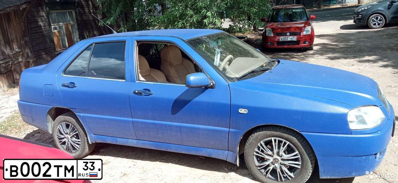 Фото автомобиля SUZUKI SWIFT, 2007 — госномер В002ТМ33. Цвет: Оранжевый