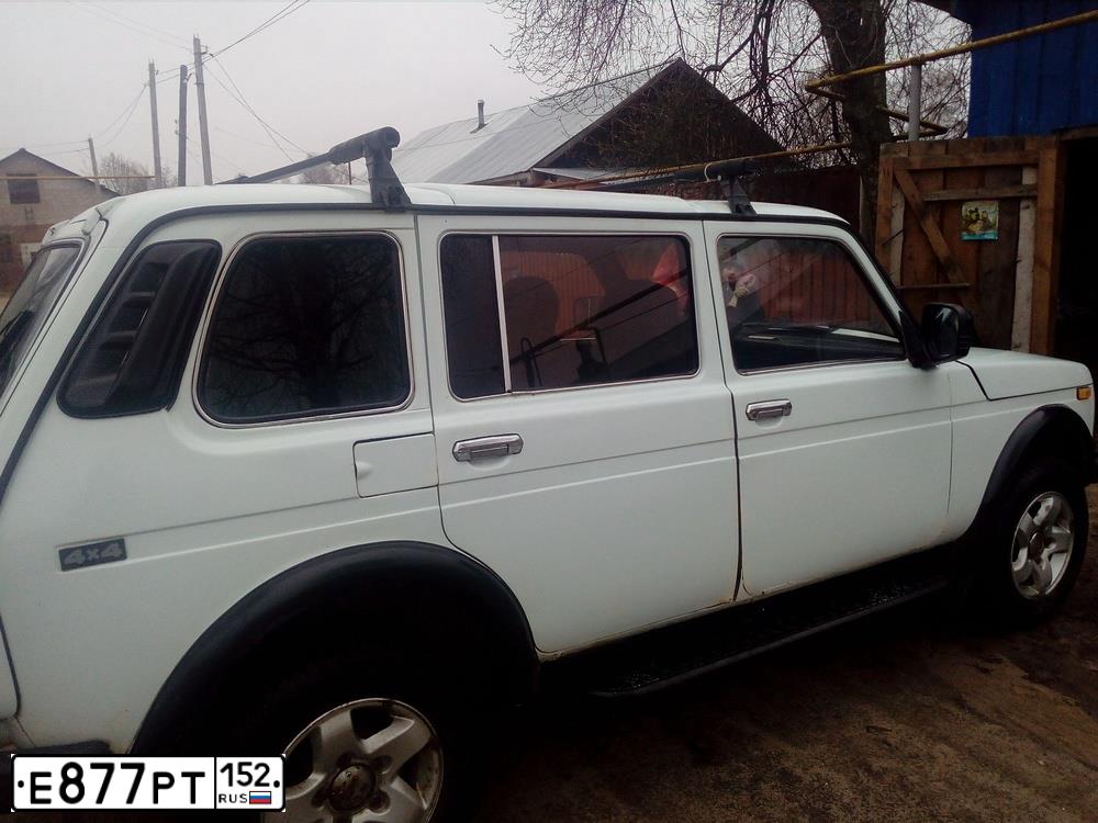 Фото автомобиля LADA 2131 NIVA, 1999 — госномер Р654ТО33. Цвет: Белый