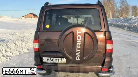 Фото автомобиля UAZ 3163 PATRIOT, 2015 — госномер Н386СО154. Цвет: КОРИЧНЕВЫЙ МЕТАЛЛИК