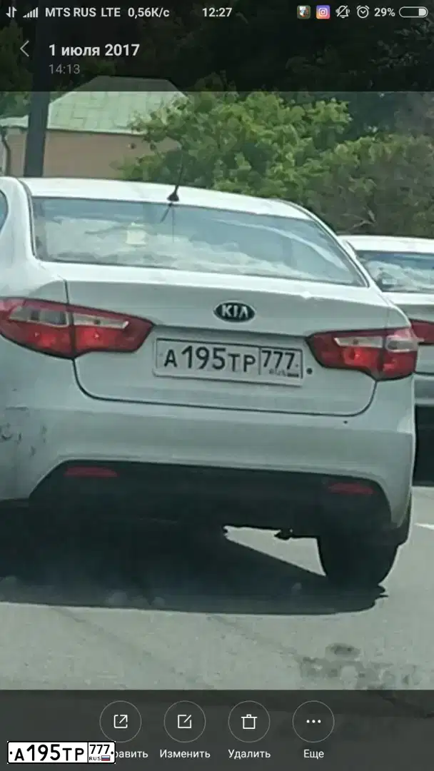 Фото автомобиля KIA RIO, 2014 — госномер М956АК134. Цвет: Белый