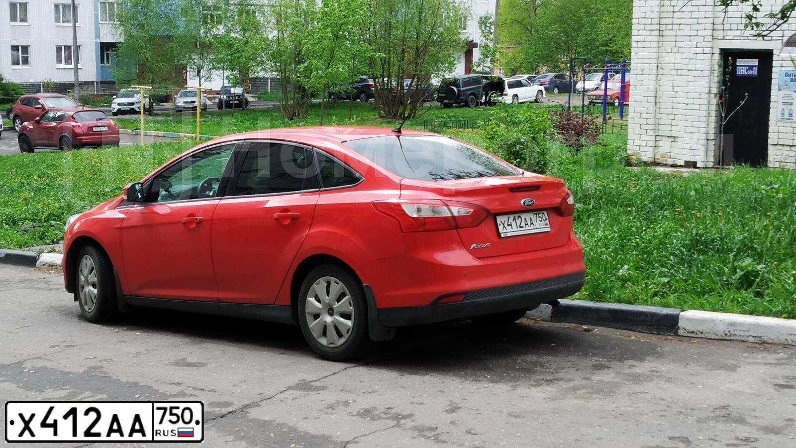 Фото автомобиля FORD FOCUS, 2014 — госномер Х412АА750. Цвет: КРАСНЫЙ