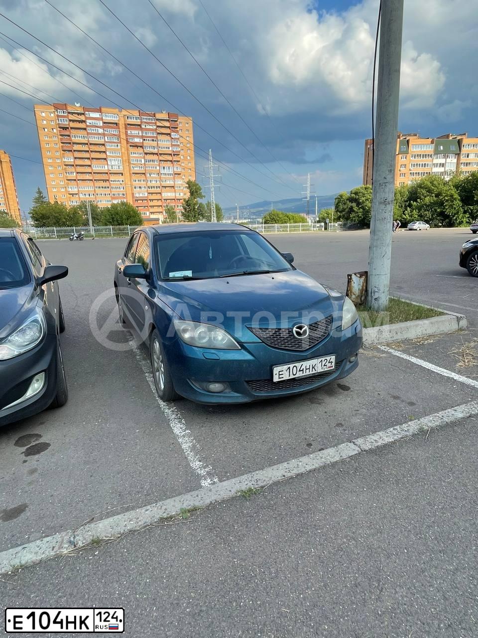 Фото автомобиля MAZDA 3, 2006 — госномер Е104НК124. Цвет: СИНЕ ЗЕЛЕНЫЙ