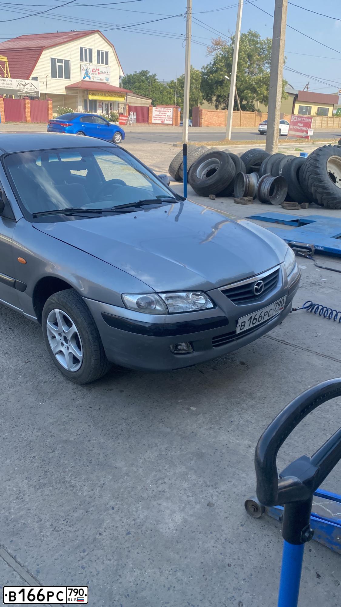 Фото автомобиля MAZDA 626, 1999 — госномер В166РС790. Цвет: Серый