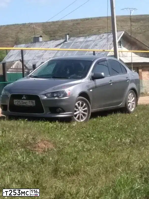 Фото автомобиля MITSUBISHI LANCER, 2012 — госномер К118СУ716. Цвет: Серый
