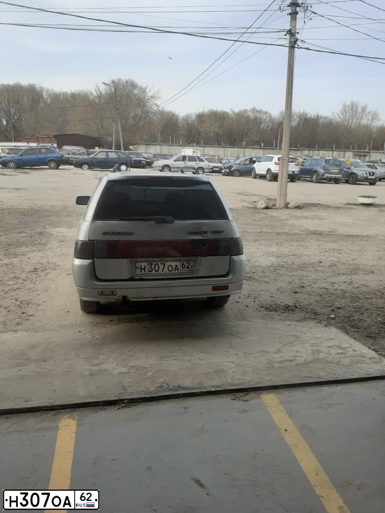 Фото автомобиля LADA 2111, 2004 — госномер Н307ОА62. Цвет: СВЕТЛО-СЕРЕБРИСТЫЙ МЕТАЛЛ