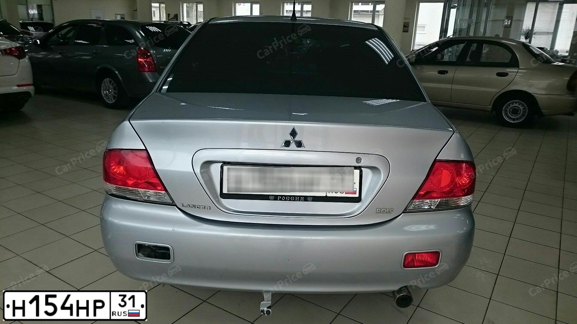 Фото автомобиля MITSUBISHI LANCER, 2005 — госномер Т765НМ31. Цвет: СЕРЕБРИСТЫЙ