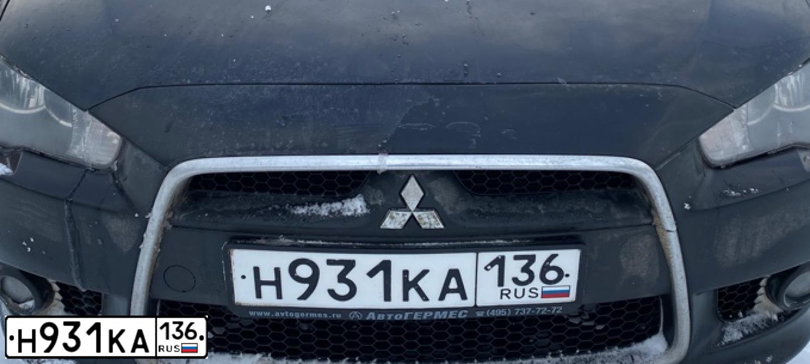 Фото автомобиля MITSUBISHI LANCER, 2012 — госномер Н931КА136. Цвет: ЧЕРНЫЙ