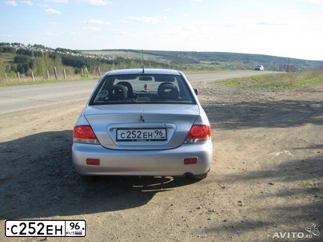 Фото автомобиля MITSUBISHI LANCER, 2006 — госномер Е586МЕ196. Цвет: СЕРЕБРИСТЫЙ