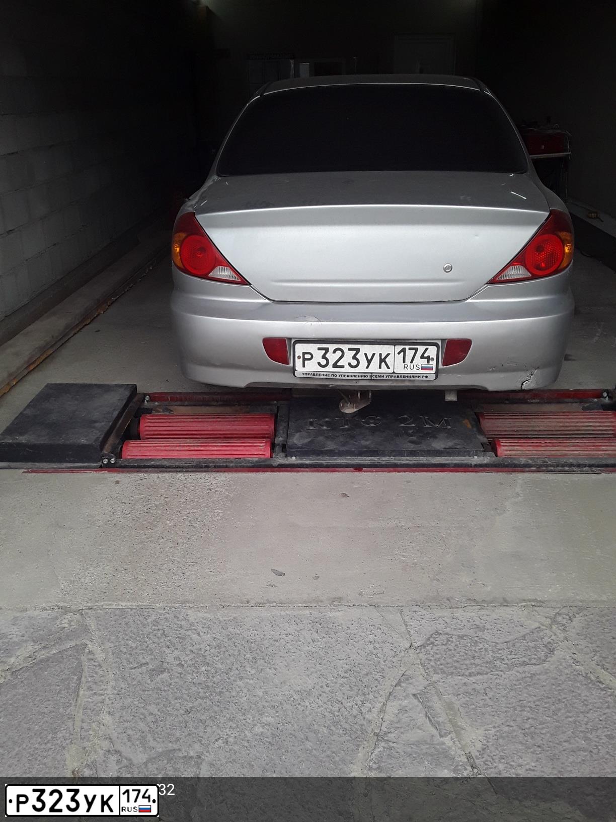 Фото автомобиля KIA SPECTRA, 2006 — госномер Р023КК174. Цвет: БЕЛЫЙ