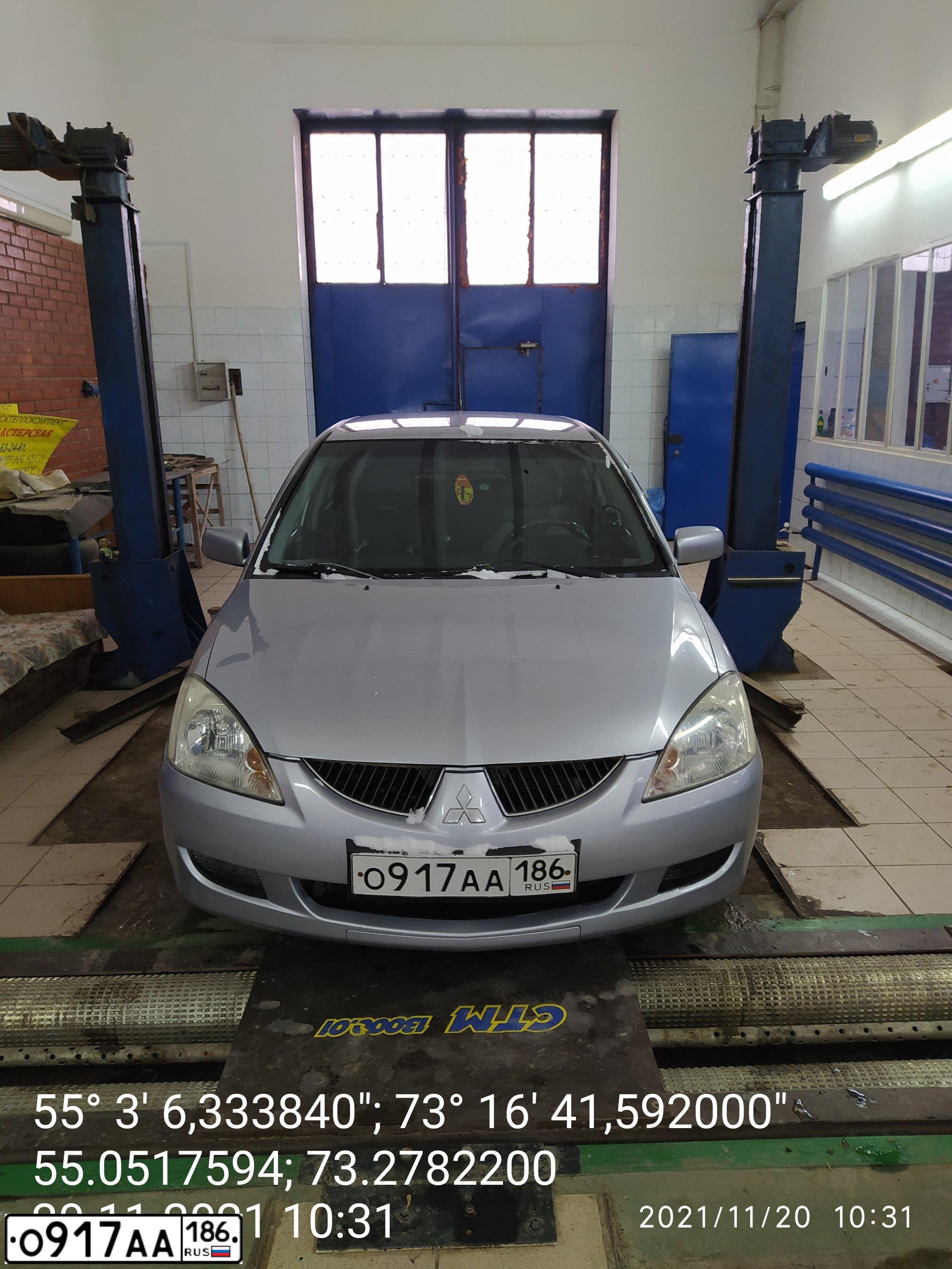 Фото автомобиля MITSUBISHI LANCER, 2004 — госномер Х979ТС55. Цвет: Серебристый