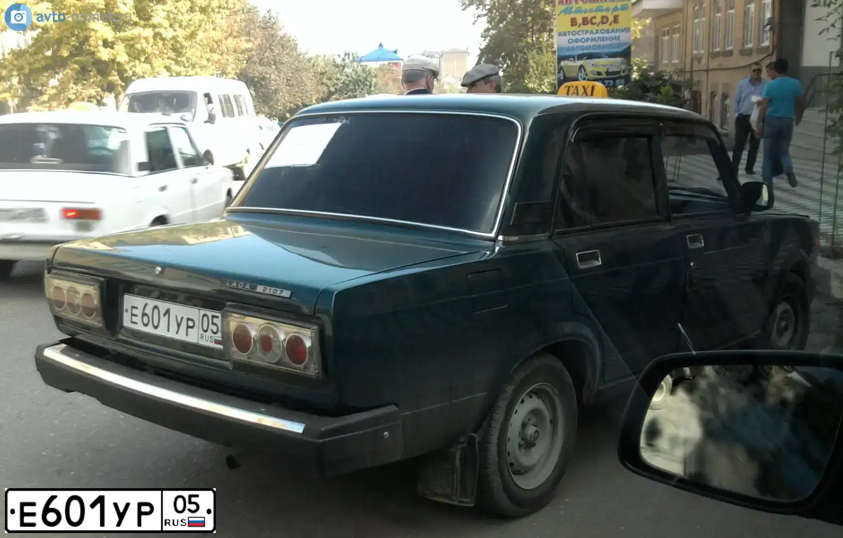 Фото автомобиля ВАЗ 21074 ЛАДА 2107, 2006 — госномер К565НН51. Цвет: Темно-зеленый