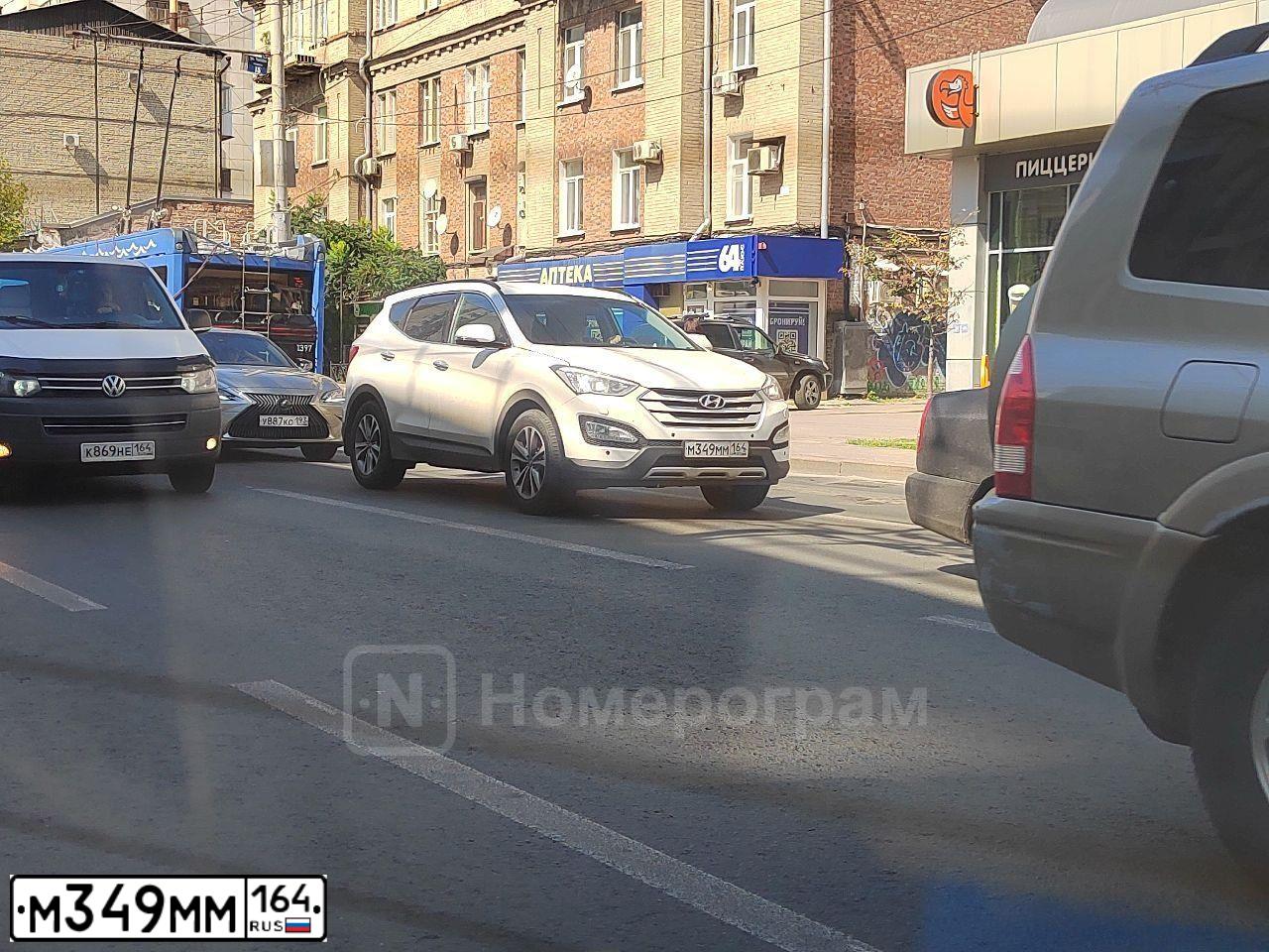 Фото автомобиля KIA SPORTAGE, 2013 — госномер М349ММ164. Цвет: Серебристый