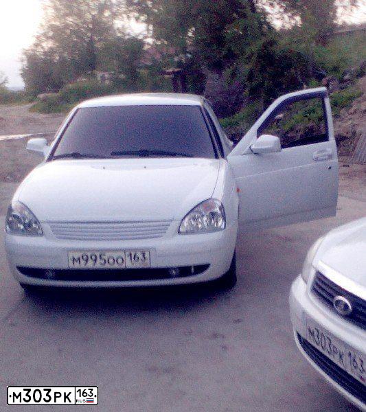 Фото автомобиля LADA 2171 PRIORA, 2009 — госномер Н308НВ30. Цвет: Белый