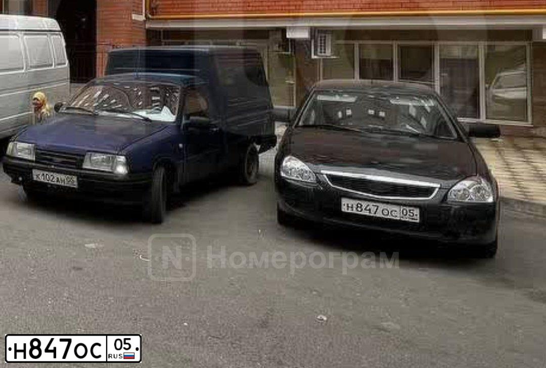 Фото автомобиля LADA 2170 PRIORA, 2013 — госномер Е060ЕЕ05. Цвет: СИНЕ-ЧЕРНЫЙ