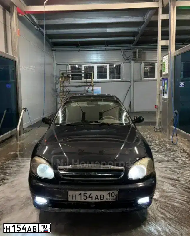 Фото автомобиля LADA 2109 SAMARA, 2001 — госномер Н154АВ10. Цвет: СЕРЕБРИСТО-ЗОЛОТОЙ