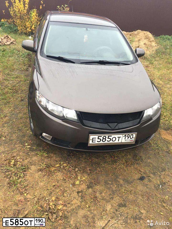 Фото автомобиля KIA CERATO, 2012 — госномер Е585ОТ190. Цвет: БЕЖЕВЫЙ