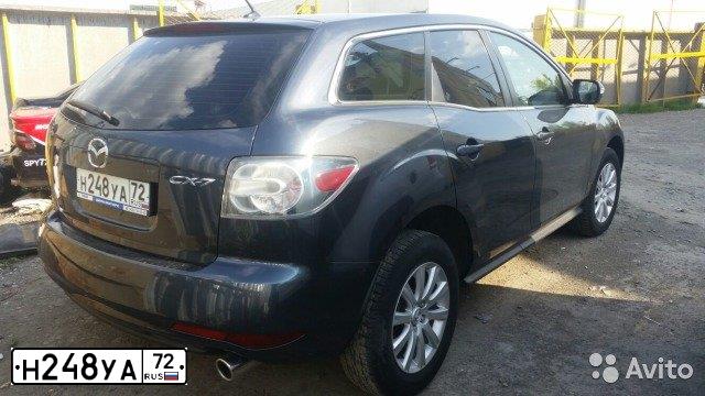Фото автомобиля MAZDA CX-7, 2011 — госномер Н248УА72. Цвет: Серый