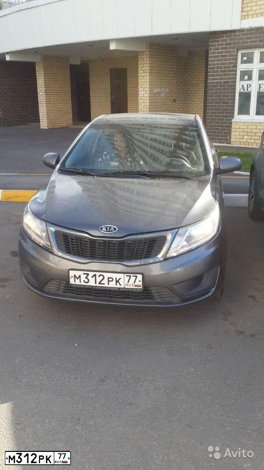Фото автомобиля KIA RIO, 2012 — госномер Н261ВР154. Цвет: СЕРЫЙ