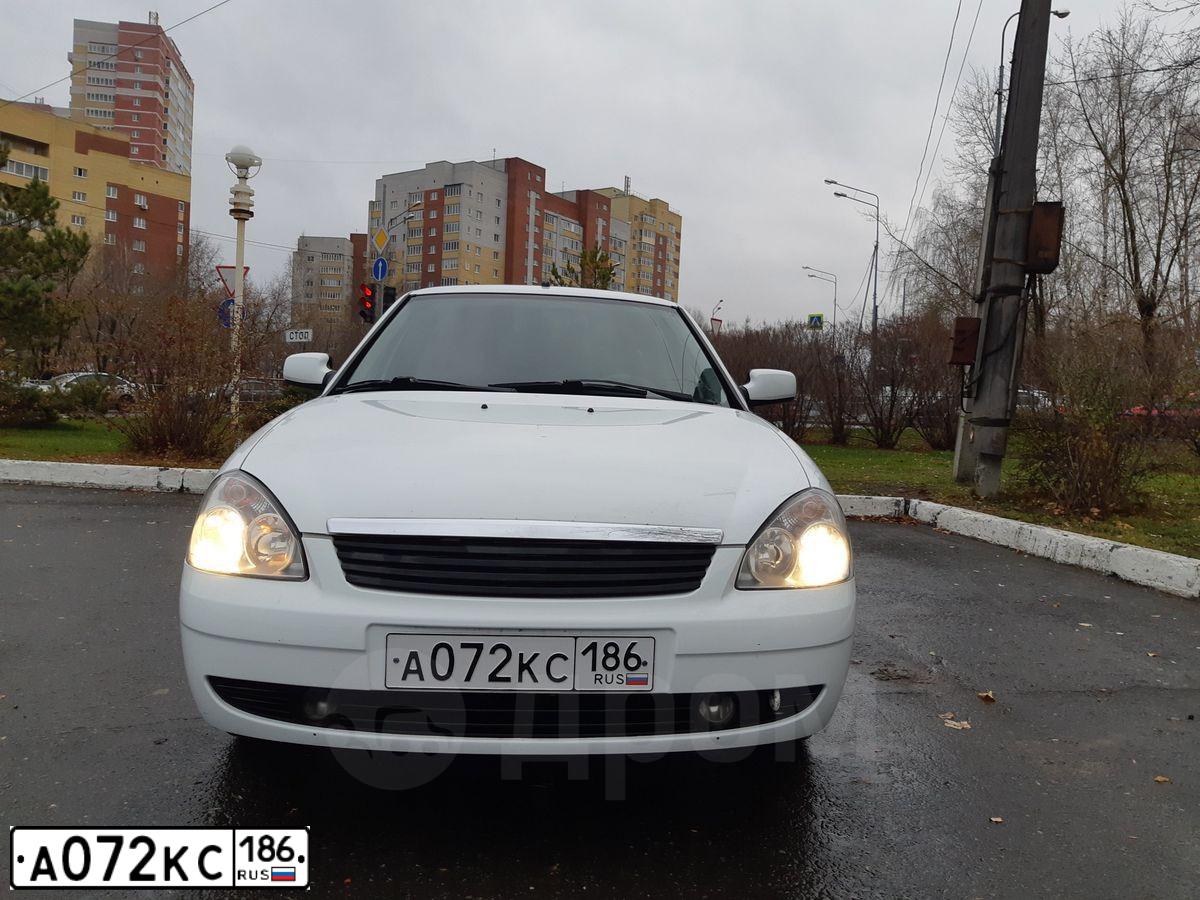 Фото автомобиля LADA 2172 PRIORA, 2011 — госномер Т919НР72. Цвет: Белый