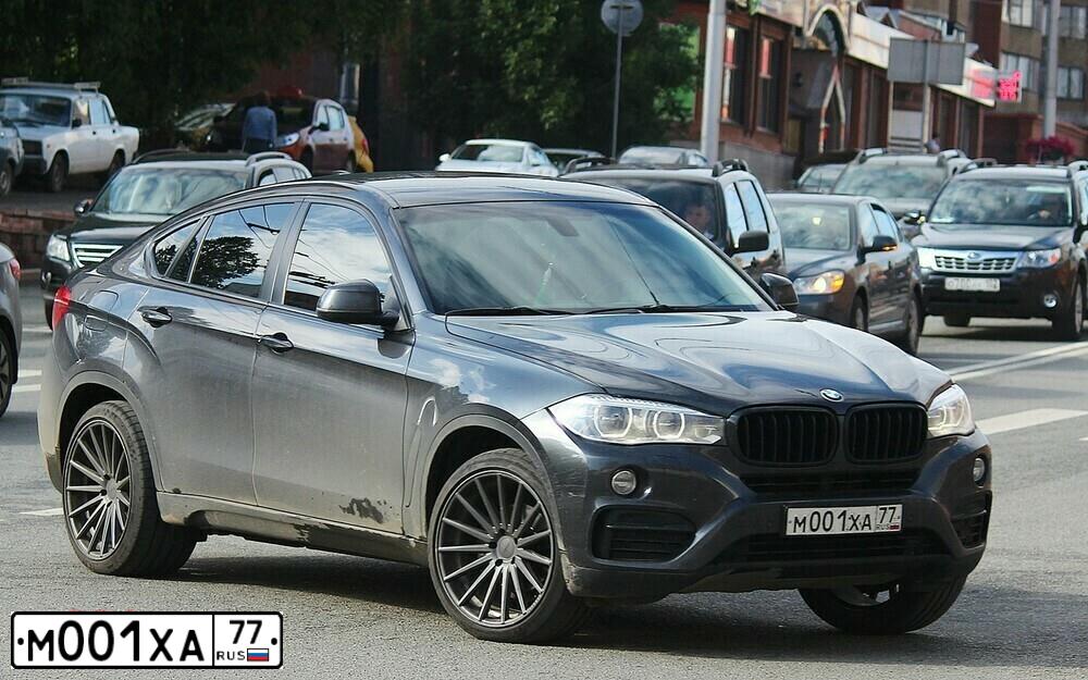 Фото автомобиля SSANGYONG ACTYON, 2013 — госномер М001ХА77. Цвет: ЧЕРНЫЙ