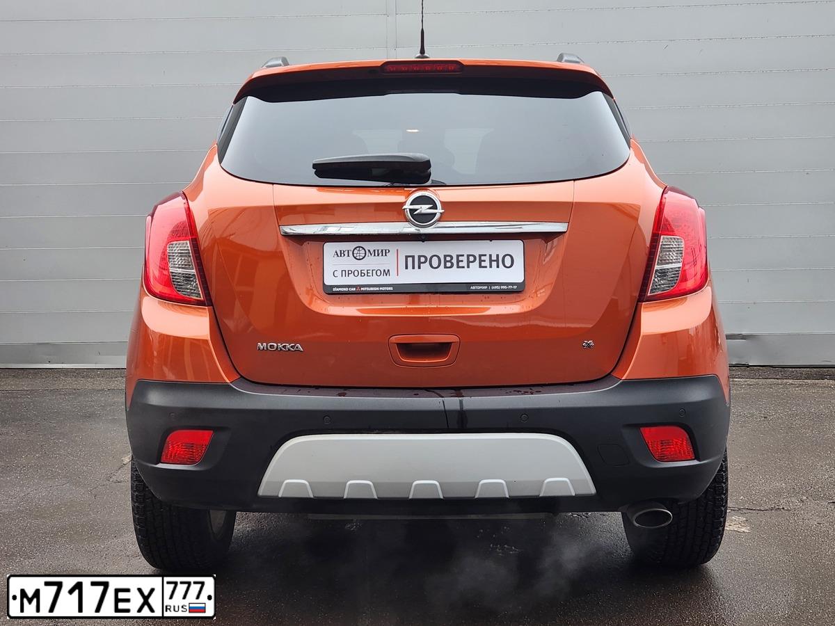 Фото автомобиля OPEL MOKKA, 2014 — госномер М717ЕХ777. Цвет: ОРАНЖЕВЫЙ