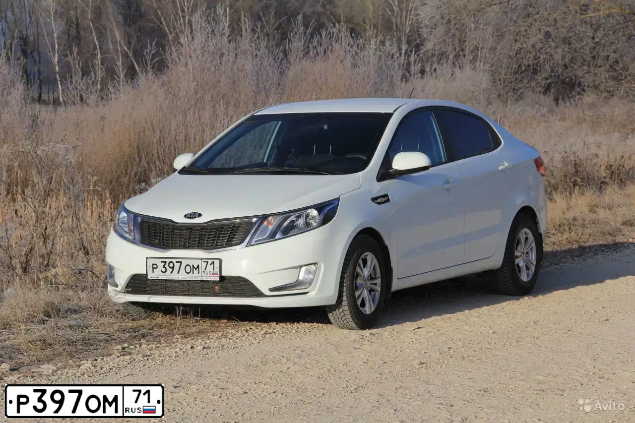 Фото автомобиля KIA RIO, 2014 — госномер У845АН71. Цвет: Белый
